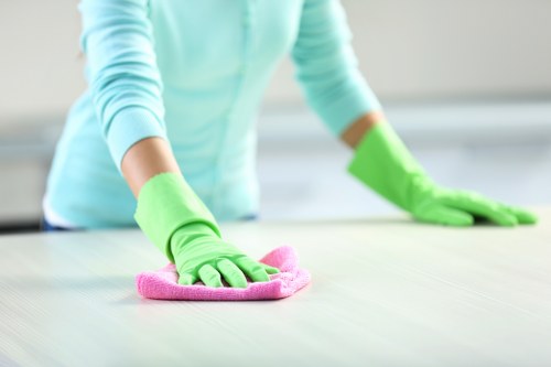 Local window cleaner handling a shopfront in Earlscourt